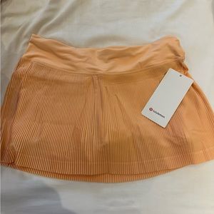 Pleat To Street Mid Rise Skirt